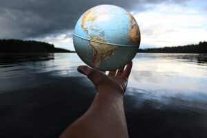 Hand holding a globe